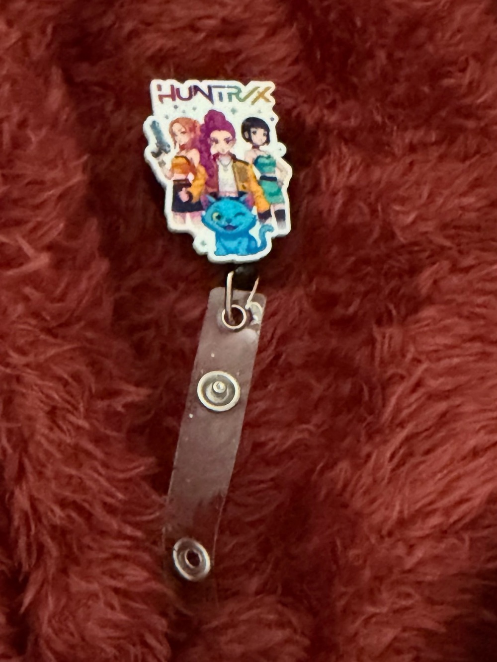 Huntrix Badge Reel with Cartoon Art